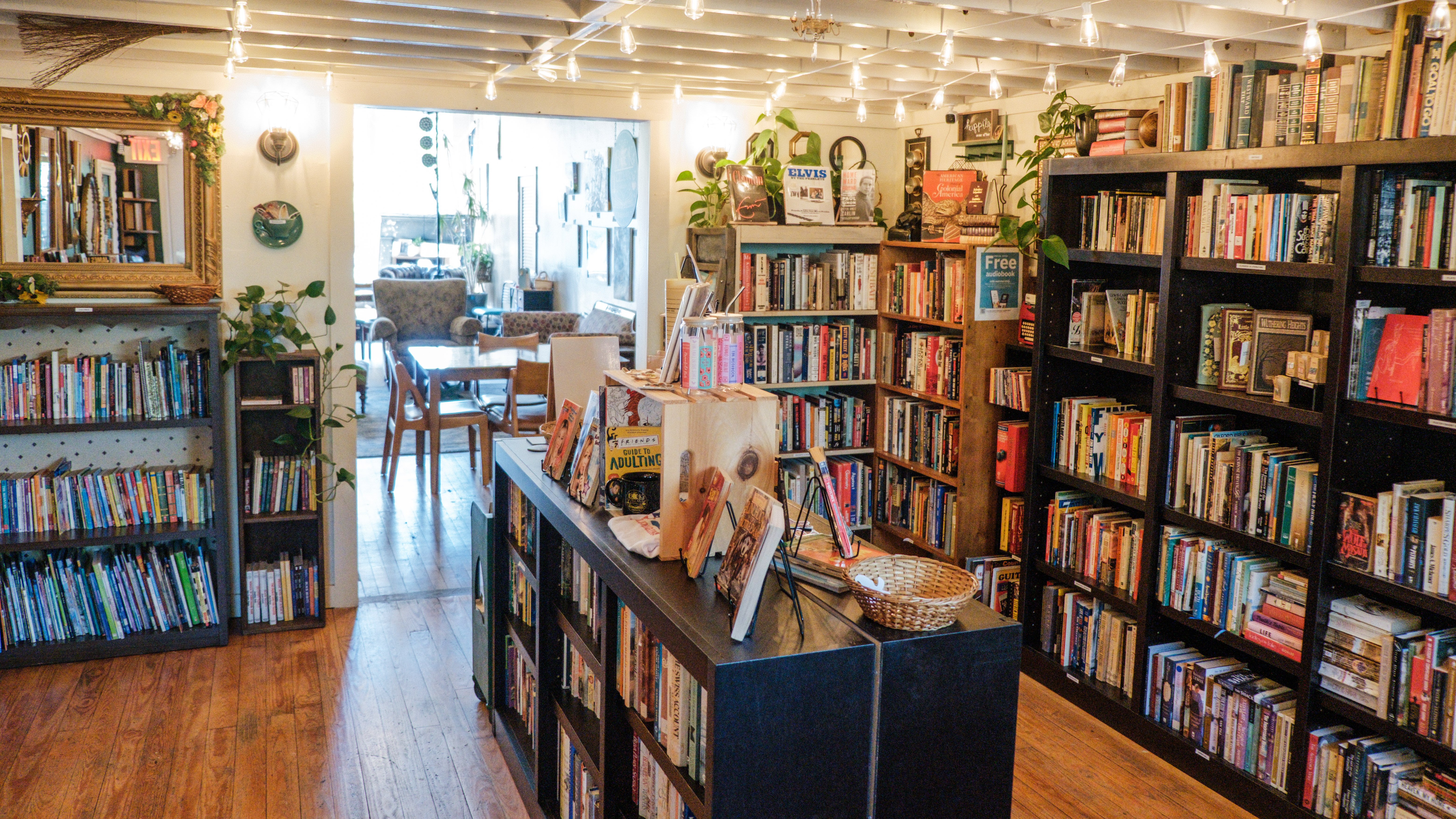 View of a small bookshop with shelves and merchandise displays
